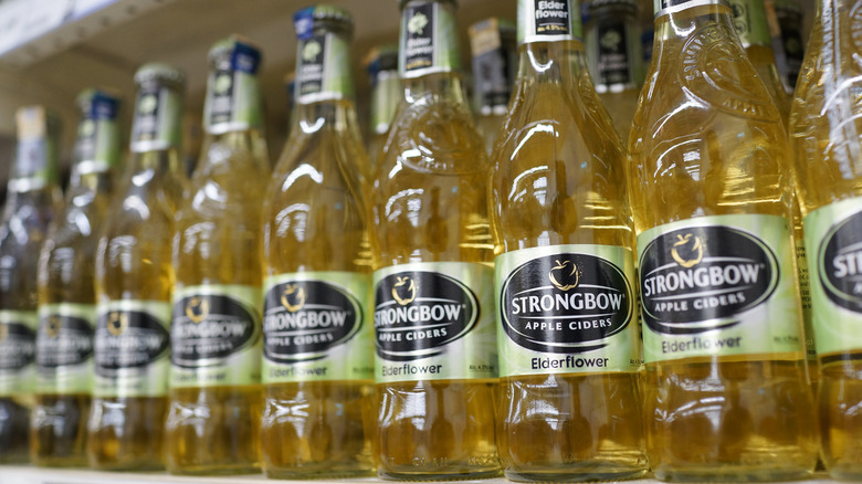 A row of Strongbow Apple Ciders elderflower flavor on the shelf in a grocery store