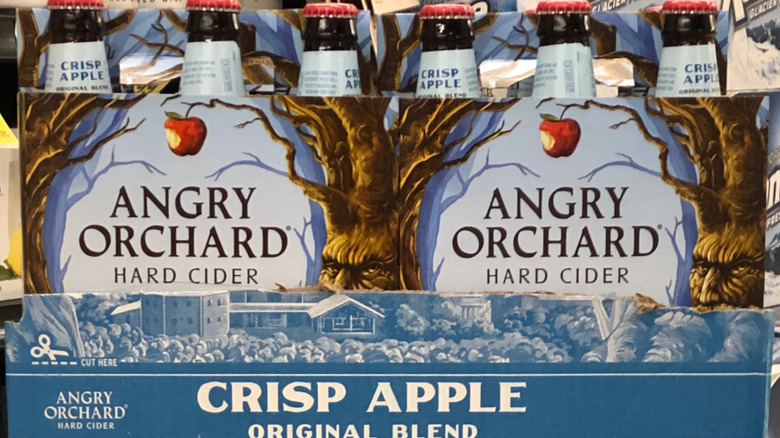 A display of two six packs of Angry Orchard's crisp apple flavor