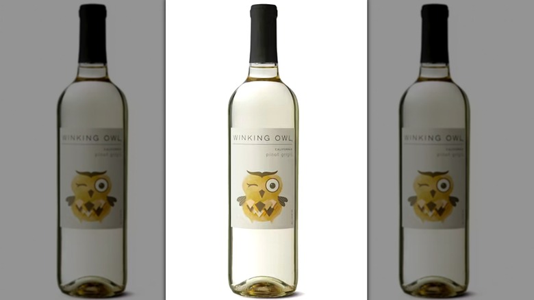 A bottle of Winking Owl pinot grigiot against a white background