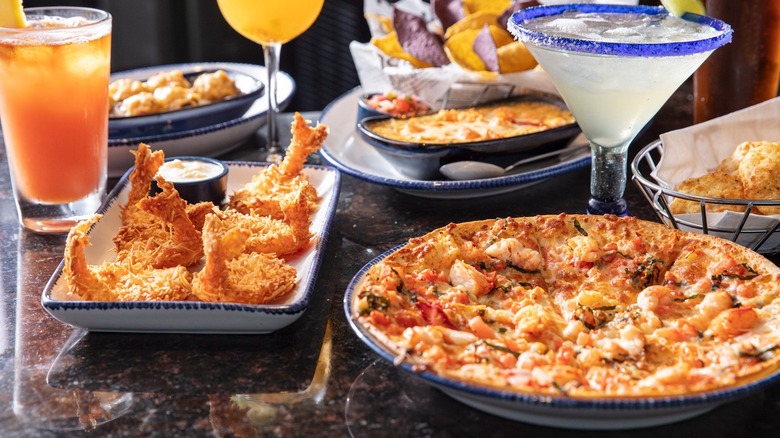 A variety of appetizers and cocktails on a table at Red Lobster