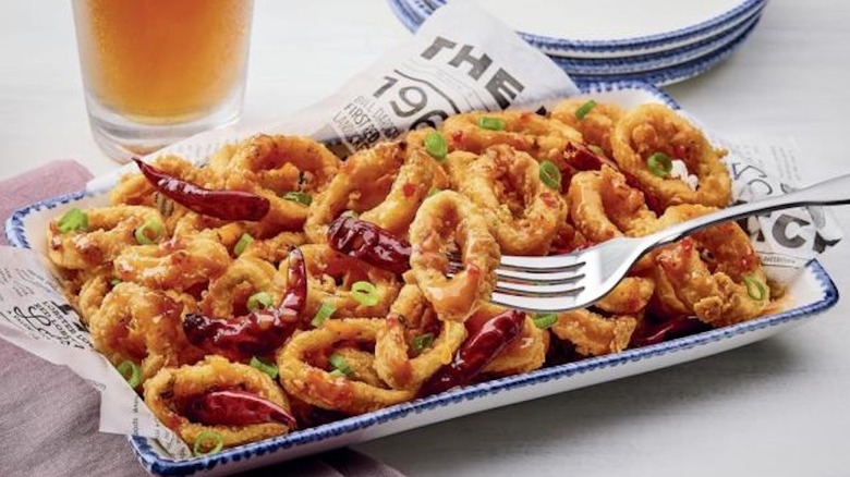 A plate of Crispy Dragon Calamari at Red Lobster with whole chilis