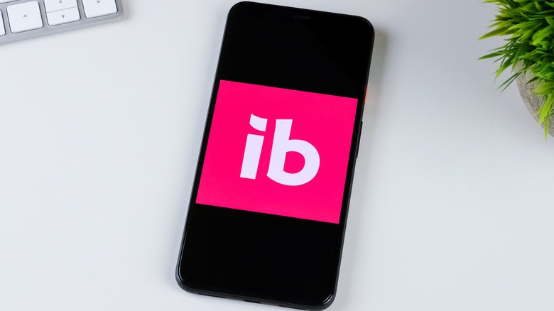 Ibotta app logo on a black smartphone screen