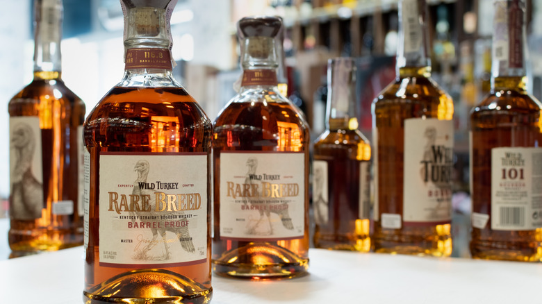 Bottles of Wild Turkey Rare Breed in front of a mirror