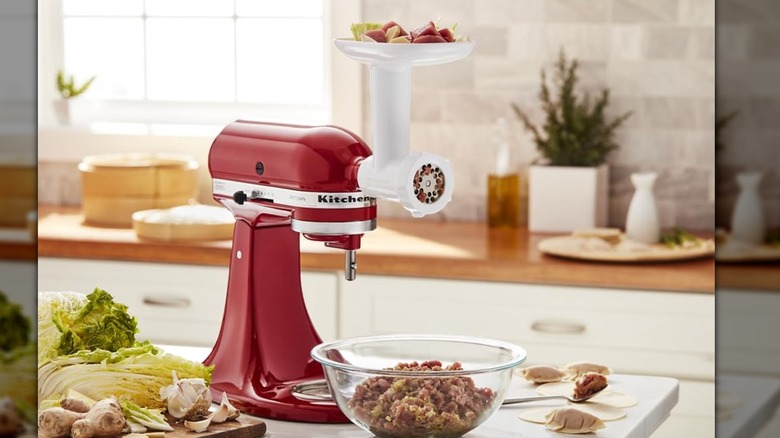 Grinder attachment on mixer with bowl of ingredients