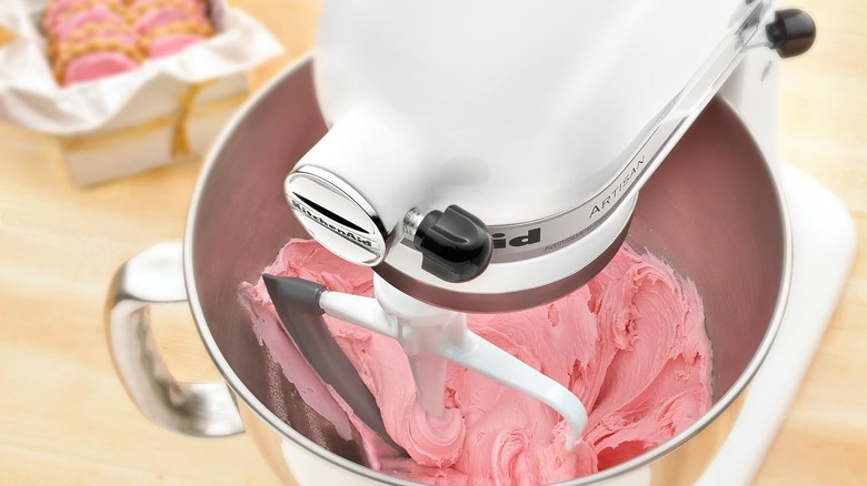 Mixer mixing up pink frosting