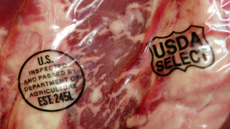 Packaged raw meat with USDA inspection marks