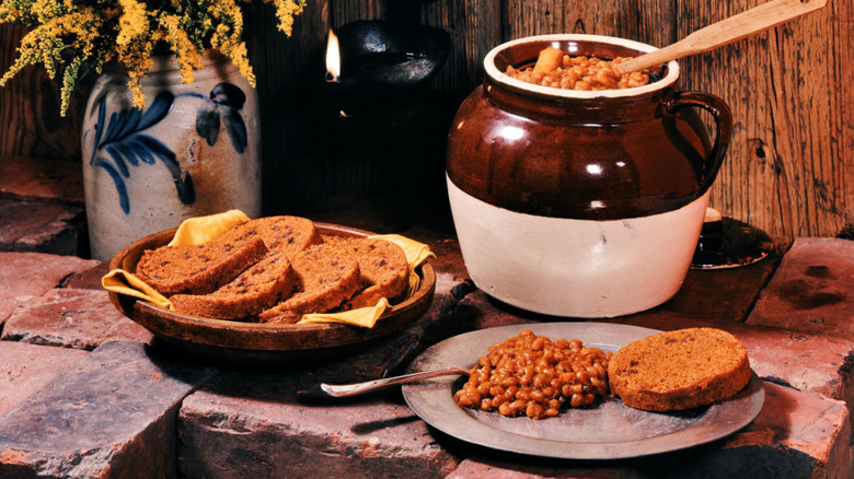 Baked beans on a plate with brown bread