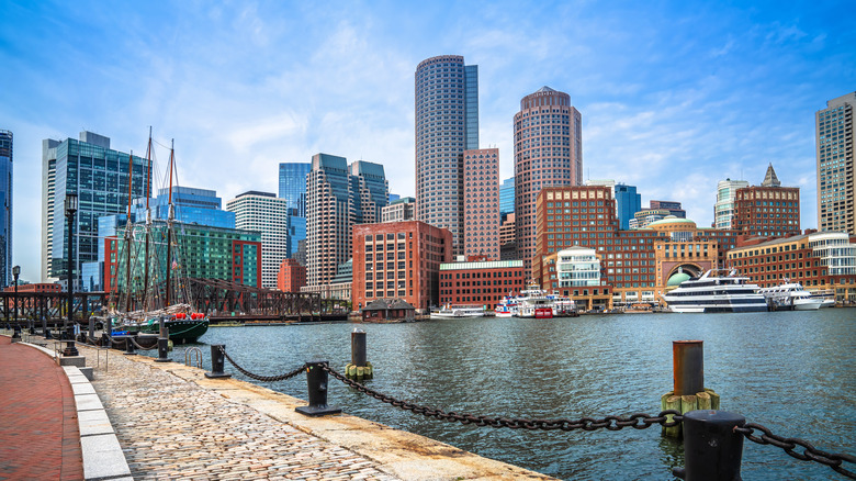 Boston seaport with skyline and walking path