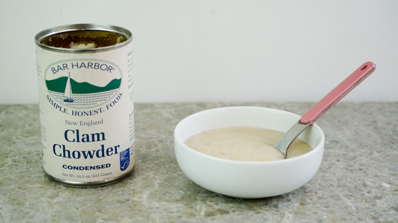 Bar Harbor New England Clam Chowder Condensed next to bowl with chowder and spoon