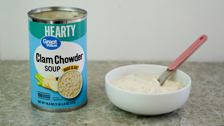 Great Value Hearty Clam Chowder Soup next to bowl with chowder and spoon