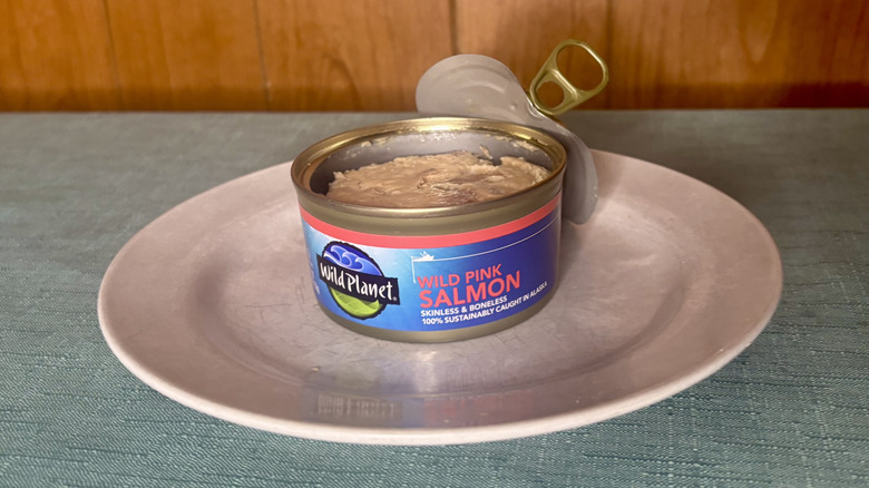 An open can of Wild Planet canned salmon on a white plate