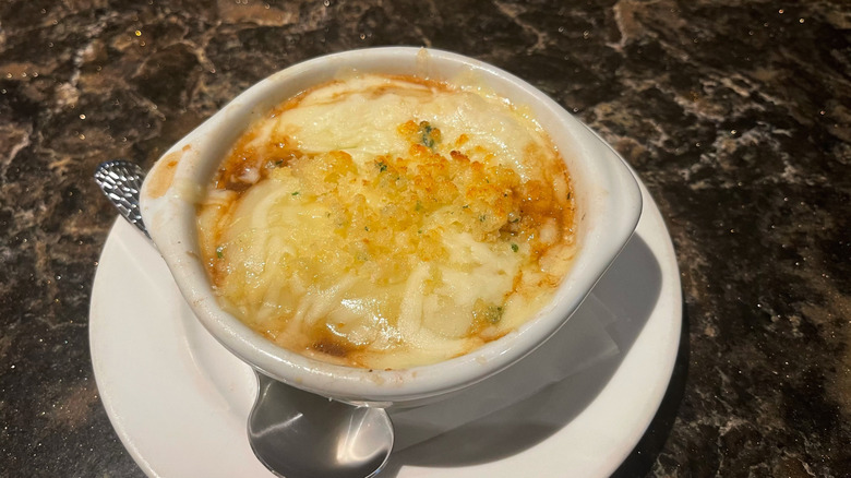 The French onion soup from Longhorn Steakhouse on a white plate