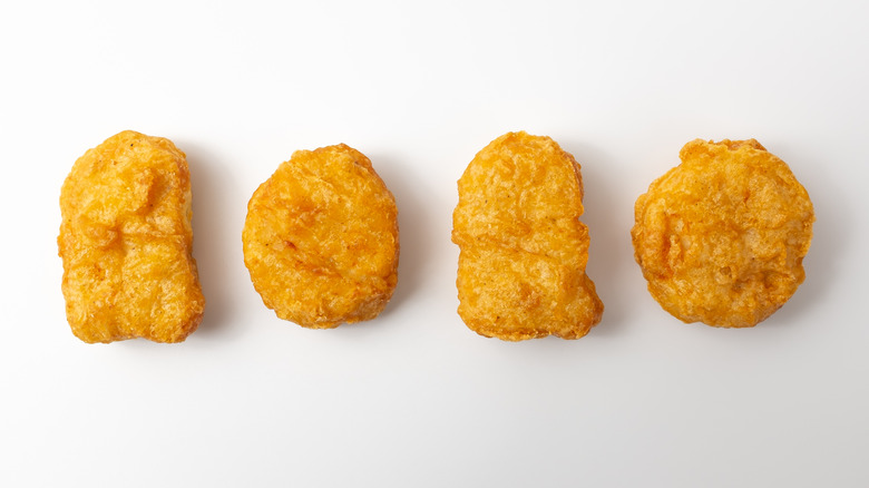 line of four chicken nuggets