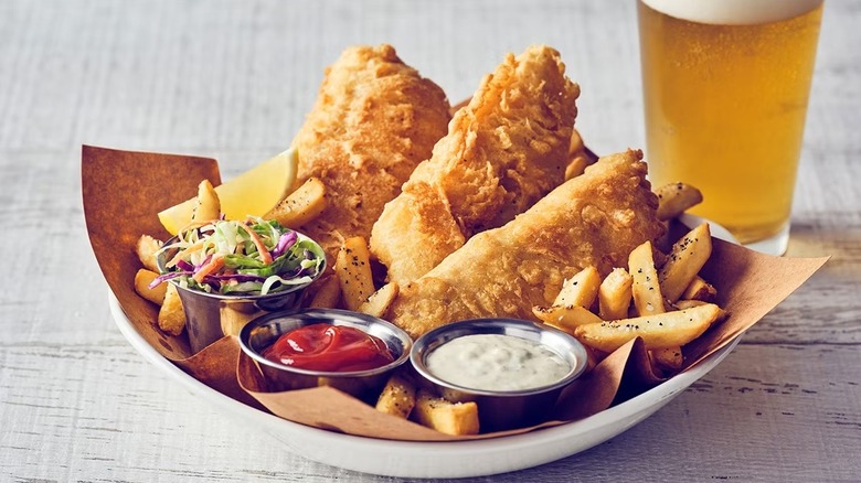 Bonefish Grill's fish and chips in a bowl with a beer.