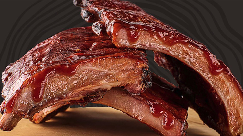 A pile of ribs on cutting board.