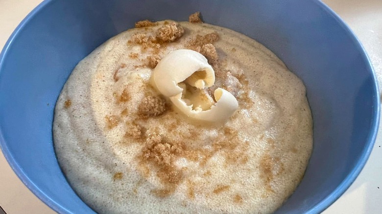 a blue bowl of Cream of Wheat with butter and brown sugar