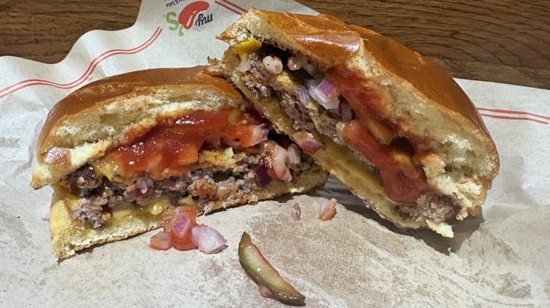 Big QP Burger cut in half