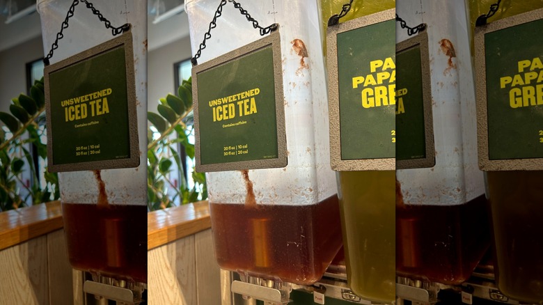 an unsweetened iced tea dispenser at Panera with interior splotched with brown, slimy material