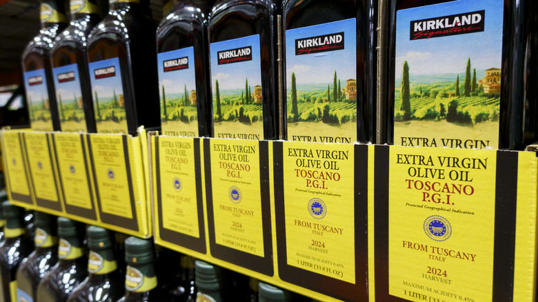Rows of 1-liter bottles of Kirkland olive oil at Costco