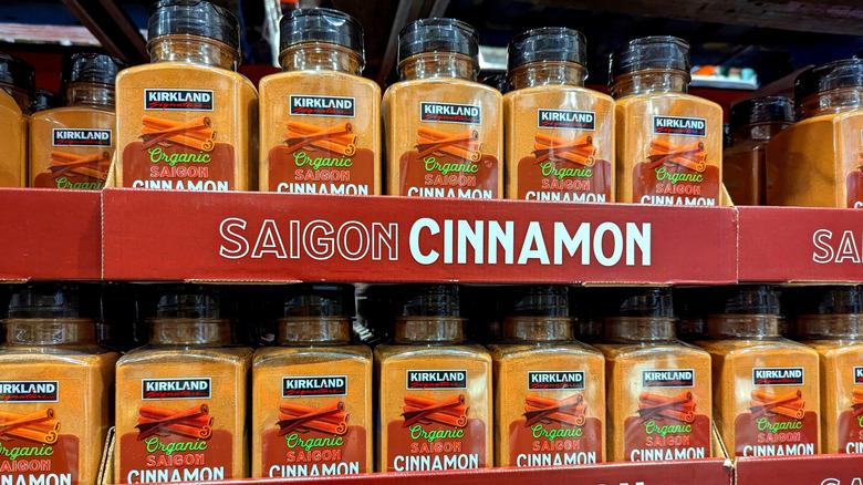 Giant bottles of cinnamon on display on a shelf at Costco