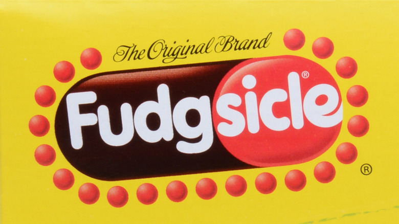 The Fudgsicle logo showing red and brown circles and ovals on a yellow background, with "The Original Brand" written in script at the top