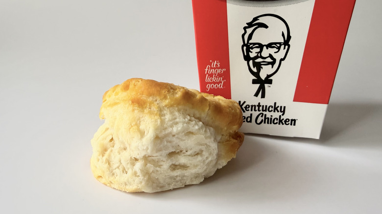 KFC's biscuit next to the fast food packaging