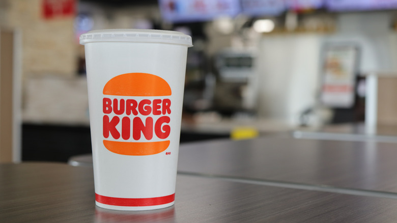 A Burger King branded cup on a table