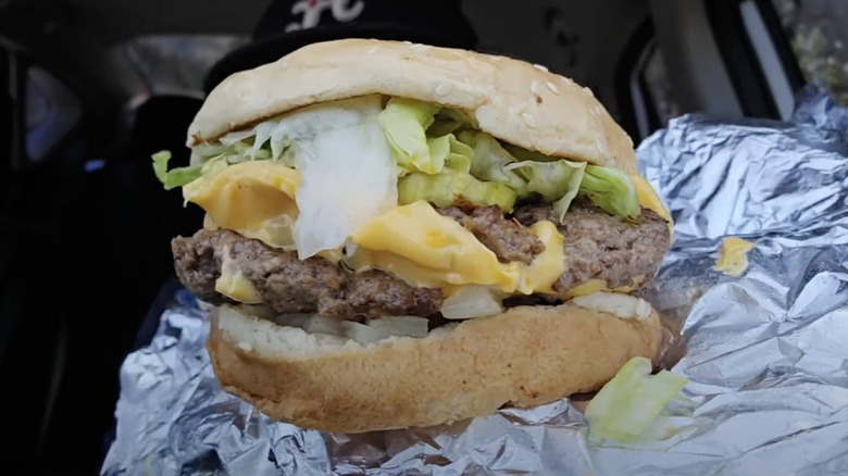 Close-up image of a Cajun cheeseburger from Five Guys