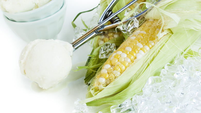 Olathe sweet corn on a white table next to a scoop of gelato and ice