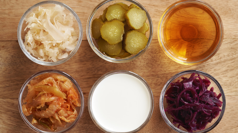 Rows of fermented vegetables in glass