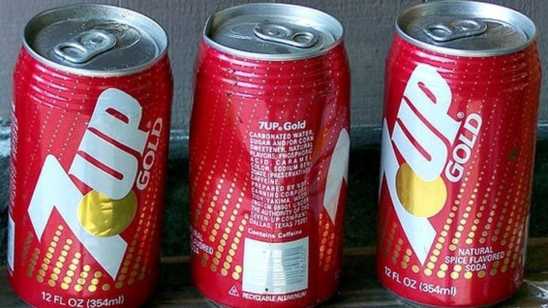 three cans of 7Up Gold