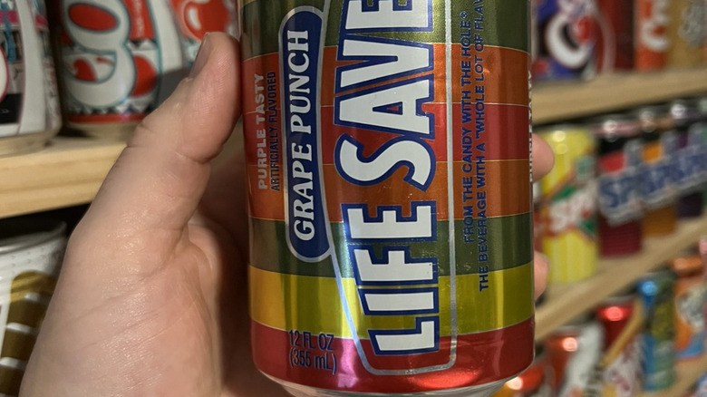 Hand holding Life Savers Soda