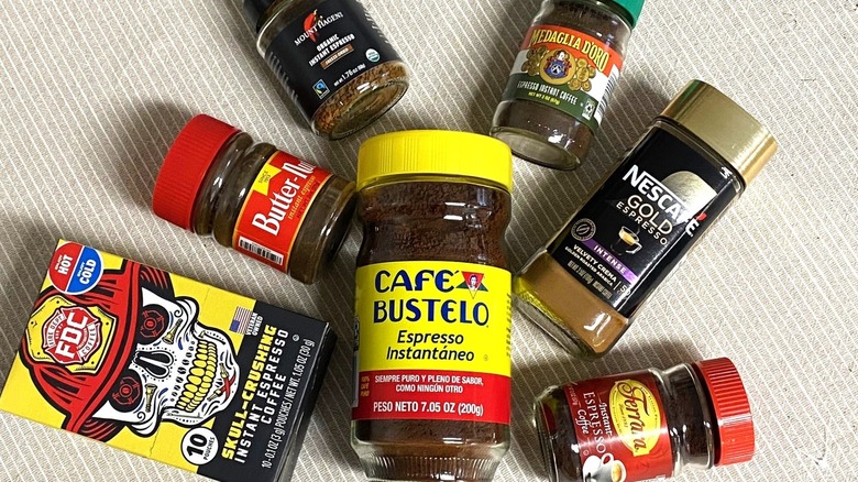 eight instant espresso jars on a table