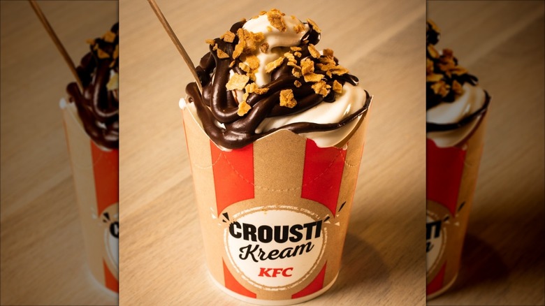 KFC Crousti Kream Nutella ice cream in a cup on a wooden surface