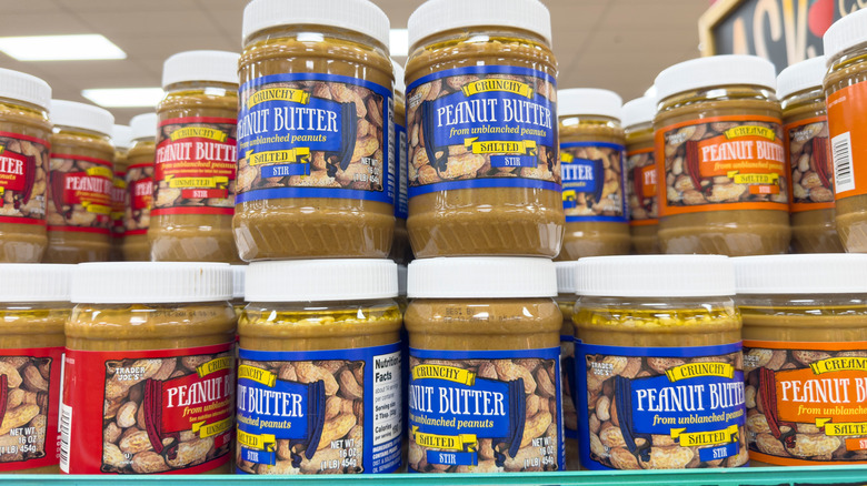 Jars of Trader Joe's peanut butter on store shelves