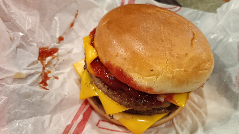 Fast food double cheeseburger on wrapper