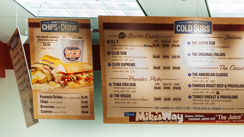 Overhead menu boards at a Jersey Mike's restaurant counter