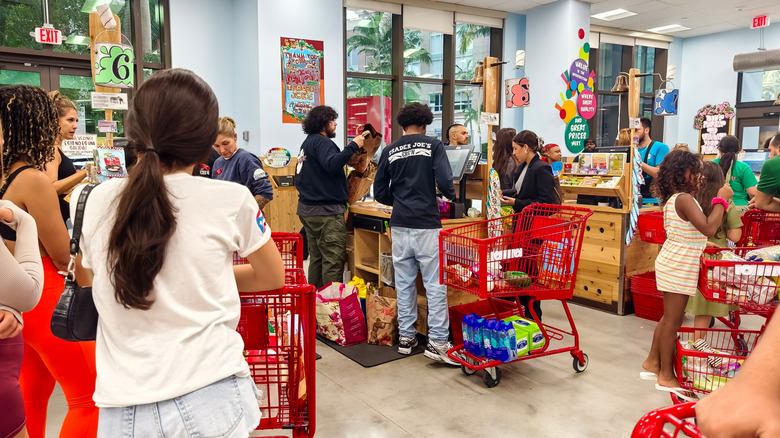 People waiting in line to check out at Trader Joe's