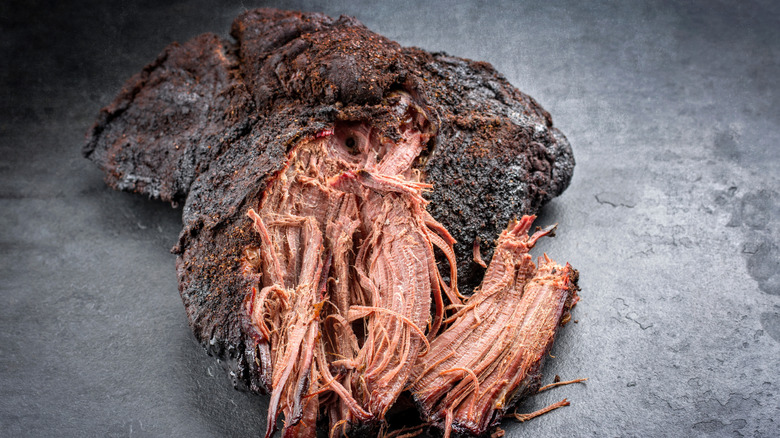 Shredded barbecued beef clods on grey tabletop