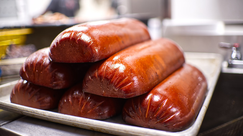 stack of barbecued bologna in a kitchen