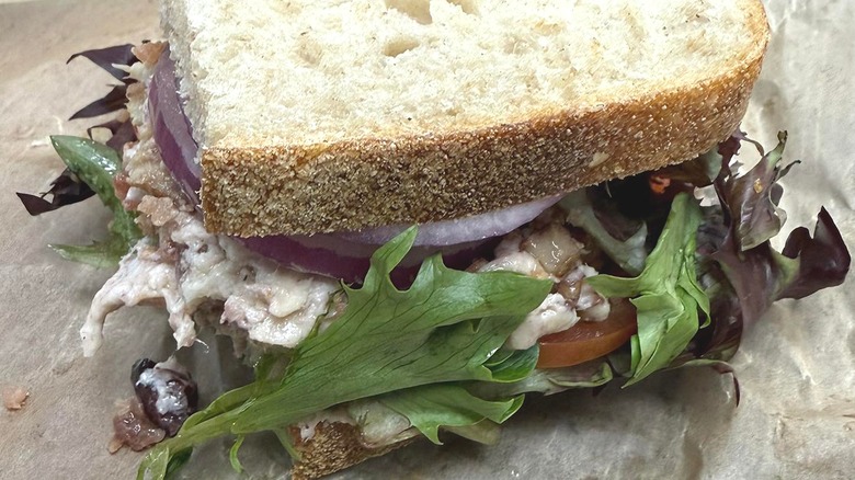 Chicken salad sandwich from Panera on parchment paper