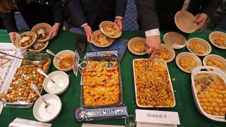Four different baking dishes filled with tater tot hotdish at a Minnesota contest