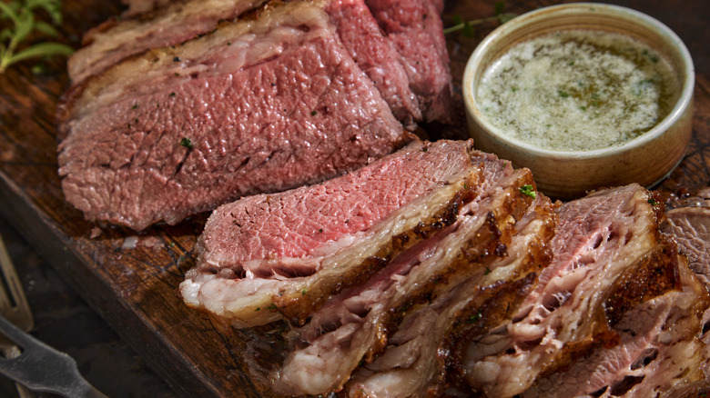 sliced Santa Maria tri-tip with a butter dipping sauce