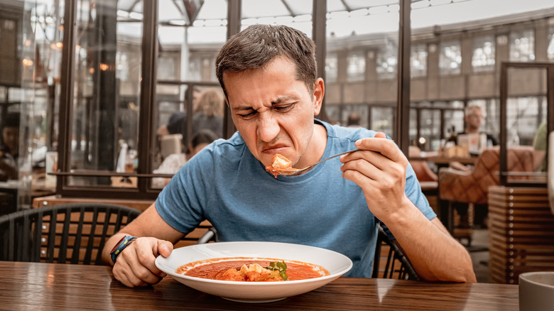 Unhappy customer disgusted by food at restaurant
