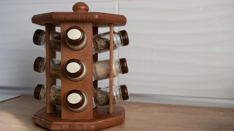 A wooden rotating spice rack