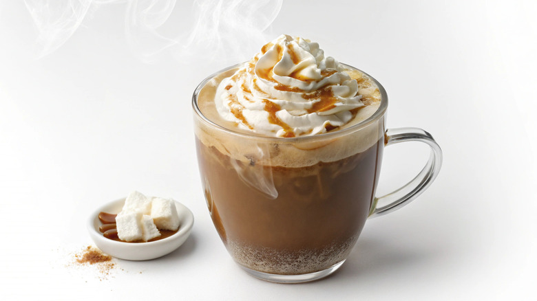 Hot chocolate topped with whipped cream and caramel