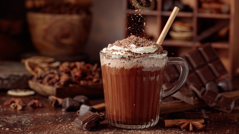 Hot chocolate topped with whipped cream and chocolate shavings