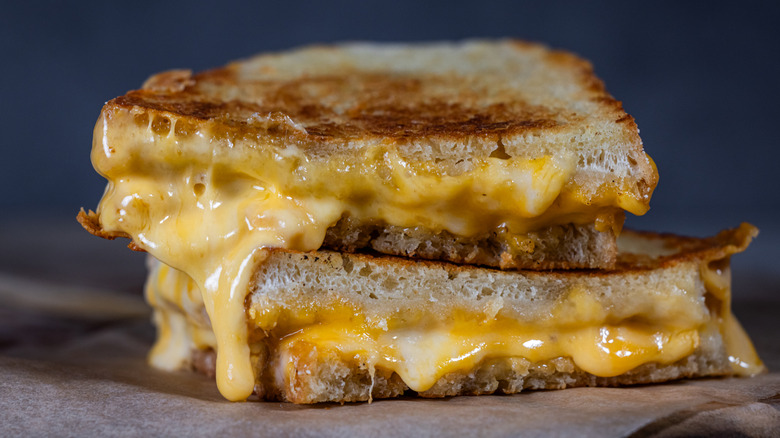 A gooey grilled cheese cut into two triangles from Texas Roadhouse