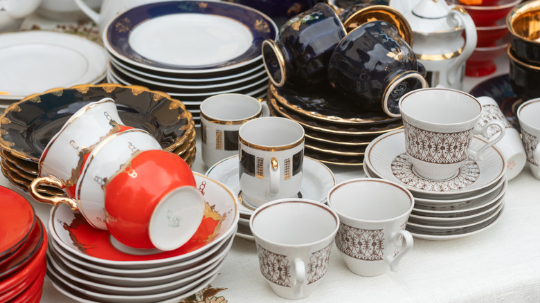 Vintage dishes on display at an antique market