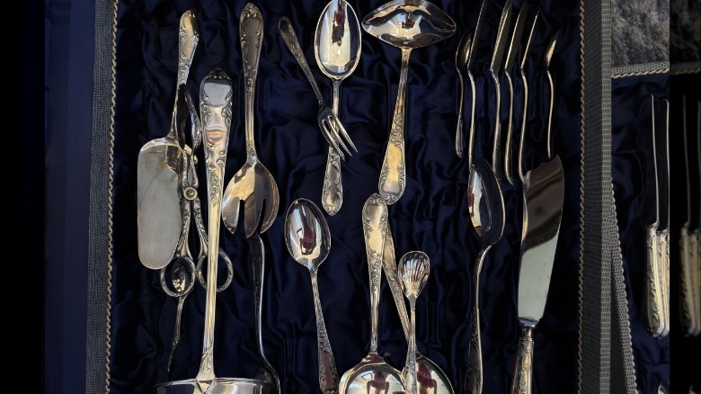 Vintage cutlery on blue fabric